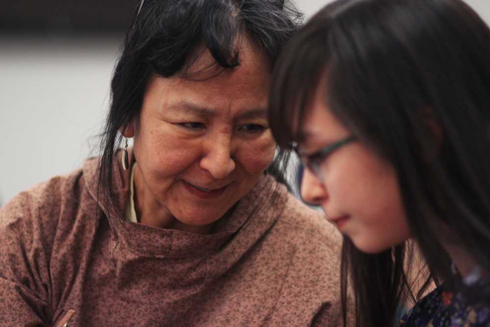 Photo by Kelly Sullivan/Peninsula Clarion Sandra King, a teacher on leave from the Lower Kuskokwim school district talks to Jayne Hanna, 14, during the 6th annual Alaska Native Oratory Society regional open mic session