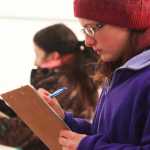Photo by Kelly Sullivan/ Peninsula Clarion Hailey McNabb silently takes makes observations during the 4H Horse Contest, Friday, April 11, at the Solid Rock Bible Camp.