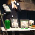 Photo by Kelly Sullivan/ Peninsula Clarion Volunteer Amelia Mueller takes ballots from the judges panel during the CFK 24th annual finalists competition, Thursday, April 17, at Kenai Central high school.