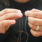 Photo by Rashah McChesney/Peninsula Clarion  Yvonne Waskey, 19, works on a beaded keychain for the Kenaitze Indian Tribe Tuesday April 15, 2014 at the Kenai Peninsula College, Kenai River Campus in Soldotna, Alaska. The crafting class is part of a "Native Creations & Reflections" series hosted by the college.