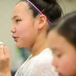Photo by Rashah McChesney/Peninsula Clarion  Angelique Lincoln, 12, practices some of the Yup'ik language fricatives by shaping her mouth and blowing over a small piece of paper during a conversational Yup'ik class at the Kenai Peninsula College, Kenai River Campus Tuesday April 15, 2014 in Soldotna, Alaska.
