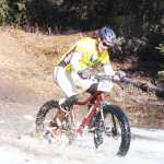 Photo by Kelly Sullivan/ Peninsula Clarion Anthony Murray rode through rough, muddy pools of melting ice on Wolverine trail, Saturday, April 19, at the Tsalteshi Trail.
