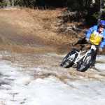 Photo by Kelly Sullivan/ Peninsula Clarion Many cyclists had to get off and walk their "weapons" through the muddy pools of melting ice on Wolverine trail, Saturday, April 19, at the Tsalteshi Trail.