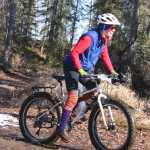 Photo by Kelly Sullivan/ Peninsula Clarion Kaitlin Vadla ploughed through muddy pools of melting ice on Wolverine trail, Saturday, April 19, at the Tsalteshi Trail.