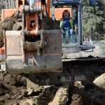 Photo by Rashah McChesney/Peninsula Clarion  Pat Heraghty operates an excavator for South Central Construction, Inc., a Soldotna company that is working on the field at Soldotna High School Tuesday April 22, 2014 in Soldotna, Alaska.