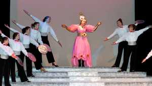 Photo by Dan Balmer/Peninsula Clarion Nikiski senior Hannah Tauriainen performs the lead role of Dolly Levi in the musical, "Hello Dolly" during a dress rehearsal Tueday at Nikiski High School. The drama class is putting on the production with shows Friday and Saturday at 7 p.m. and the following weekend May 2,3 at 7p.m. at the Nikiski High School auditorium.
