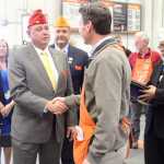 Photo by Dan Balmer/Peninsula Clarion American Legion National Commander Daniel Dillinger thanks Kenai Home Depot store manager Mark Pierson for the reserving a parking spot for veterans Thursday in Kenai. Dillinger, from Virginia, is in town for the 95th annual American Legion Alaska Department Convention from Thursday to Saturday at Post 20 in Kenai. American Legion dignitaries presented the store with a plague and a United States flag to show their appreciation for their support of veterans.
