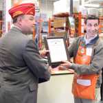 Photo by Dan Balmer/Peninsula Clarion American Legion National Commander Daniel Dillinger presents Kenai Home Depot store manager Mark Pierson with a certificate of appreciation for the store's honor of veterans with a reserved parking space.