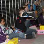 Credit Union 1 gives a big check to Teen Center and Payless gives shoes to kids