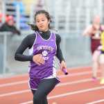 Photo by Rashah McChesney/Peninsula Clarion  Skyview junior Kaylee Fischer runs the final leg of a relay Saturday April 26, 2014 during a track meet at Kenai Central High School in Kenai, Alaska.