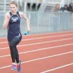 Photo by Rashah McChesney/Peninsula Clarion  Soldotna sophomore Daisy Nelson wins the final leg of a relay race Saturday April 26, 2014 during a track meet at Kenai Central High School in Kenai, Alaska.