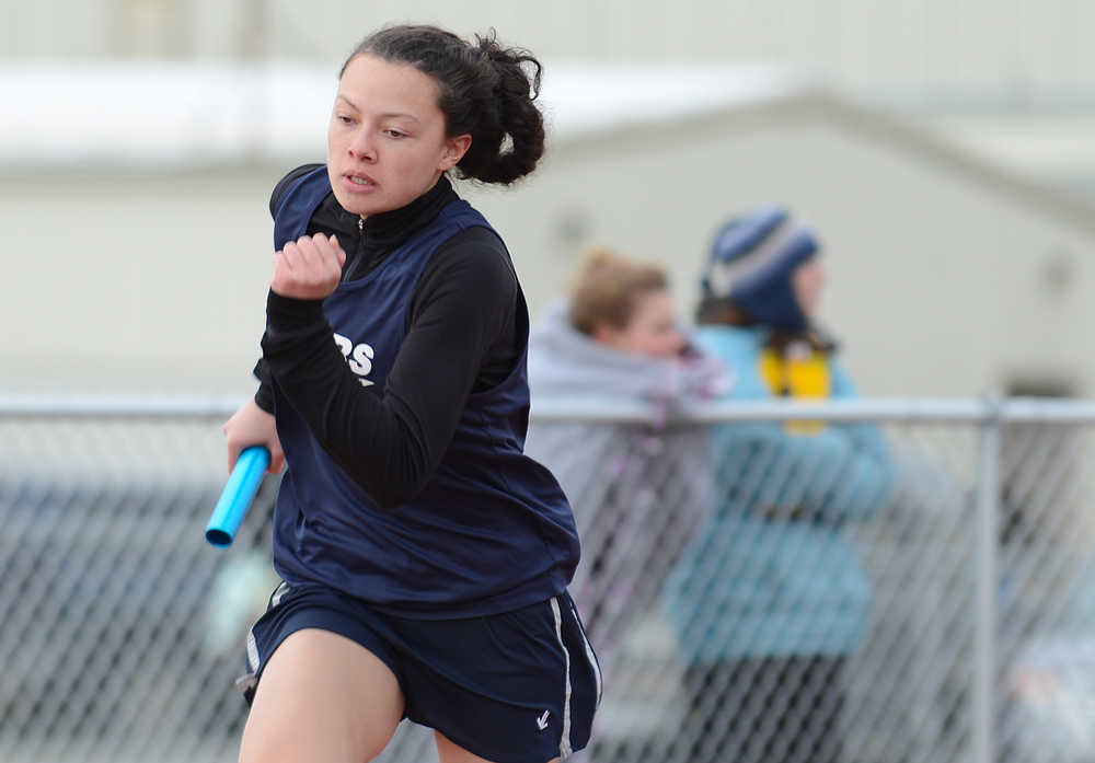 Photo by Rashah McChesney/Peninsula Clarion  Soldotna junior Lindsey Wong starts the first leg of a relay race Saturday April 26, 2014 during a track meet at Kenai Central High School in Kenai, Alaska.