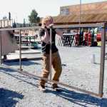 Photo by Kelly Sullivan/ Peninsula Clarion Eric Long and Cub Finney helps during clean up for Construction Career Day, Tuesday, April 29, at the Soldotna Sports Center.