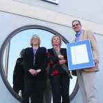 Photo by Kelly Sullivan/ Peninsula Clarion After Robia Bishop's ceremonial installment, Sherrill Behm and Ronald Haberman joined her outside the Post Office, Wednesday, April 30, in Soldotna.