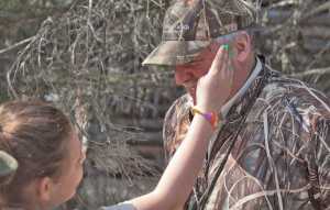 Photo by Rashah McChesney/Peninsula Clarion  Dana Gibson brushes a mosquito off of Andy Loranger, Refuge Manager at the Kenai Wildlife Refuge, Saturday May 3, 2014 during a Youth Game Warden Camp at the refuge headquarters in Soldotna, Alaska.