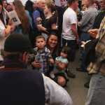 Photo by Kelly Sullivan/ Peninsula Clarion  Jasmine Ingraham holds her son Christian Ingraham and daughter Felicity Himmel-Ingraham during a photo, Thursday, May 8, at the Kenai Peninsula College graduation reception.