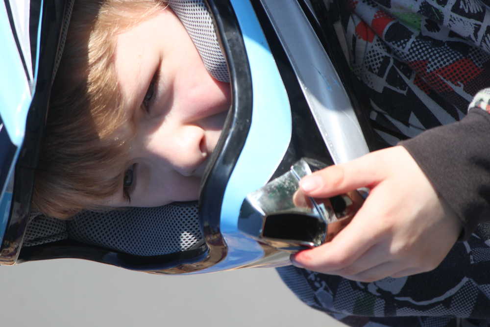 Photo by Kelly Sullivan/Peninsula Clarion Angelina Bond was prepared for the bright sunshine that beat down on the Bike Rodeo, Friday, May 9, at Mountain View Elementary School.