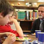 Photo by Kelly Sullivan/ Peninsula Clarion Sen. Peter Micciche sat with the winners during lunch and asked them if they would continue reading over the summer, Friday, May 9, at Soldotna Elementary School.