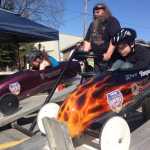 Racers get ready at the starting gate with race director Scott Hamann during the Kenai Rotary Club's Soap Box Derby, held on Spruce Street in Kenai on May 10.