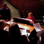 Photo by Rashah McChesney/Peninsula Clarion  Renee Henderson works with an alumni choir before her final Kenai Central High School choir concert Tuesday May 6, 2014 in Kenai, Alaska. Henderson, who has been teaching music at the high school for 43 years, will retire at the end of the 2013-14 school year.