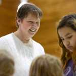 Photo by Rashah McChesney/Peninsula Clarion Mountain View Elementary school principal Norma Holmgaard laughs with a group of students as they line up for lunch Friday May 16, 2014 in Kenai, Alaska. Holmgaard is leaving the Kenai Peninsula Borough School District at the end of the 2013-14 school year.