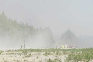 Photo courtesy Pam Howard Emergency crews stage at the end of the runway in Tyonek Monday afternoon. The blaze grew to 80 acres by Monday evening.