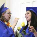 Kenai Alternative High School graduates Paulette Osborn (left) and Jacqueline Bates (right) got teary-eyed after receiving their diplomas on Monday. Photo by Kaylee Osowski/Peninsula Clarion