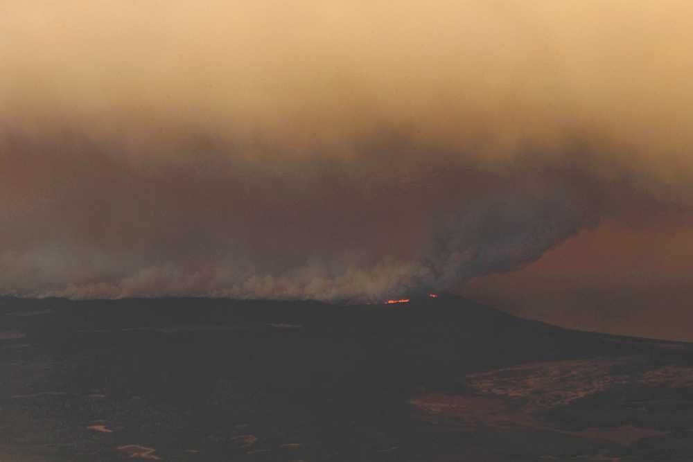 Photo by Rashah McChesney/Peninsula Clarion  Smoke from the Funny River Fire shot more than 8,000 feet in the air Tuesday May 20, 2014 as the fire spread to consume nearly 7,000 acres of Kenai National Wildlife Refuge land in less than 24 hours. Dry, windy conditions have exacerbated the fire conditions spreading it into a line stretching more than 10 miles long and about 1 mile wide.