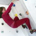 Photo by Dan Balmer/Peninsula Clarion Mia Gridley, 9, holds onto the sloped rock wall built in her familiy's garage. Her mom Natalie Larson teaches rock climbing for kids with one-hour sessions and is available from noon to 7 p.m. Monday - Thursday.