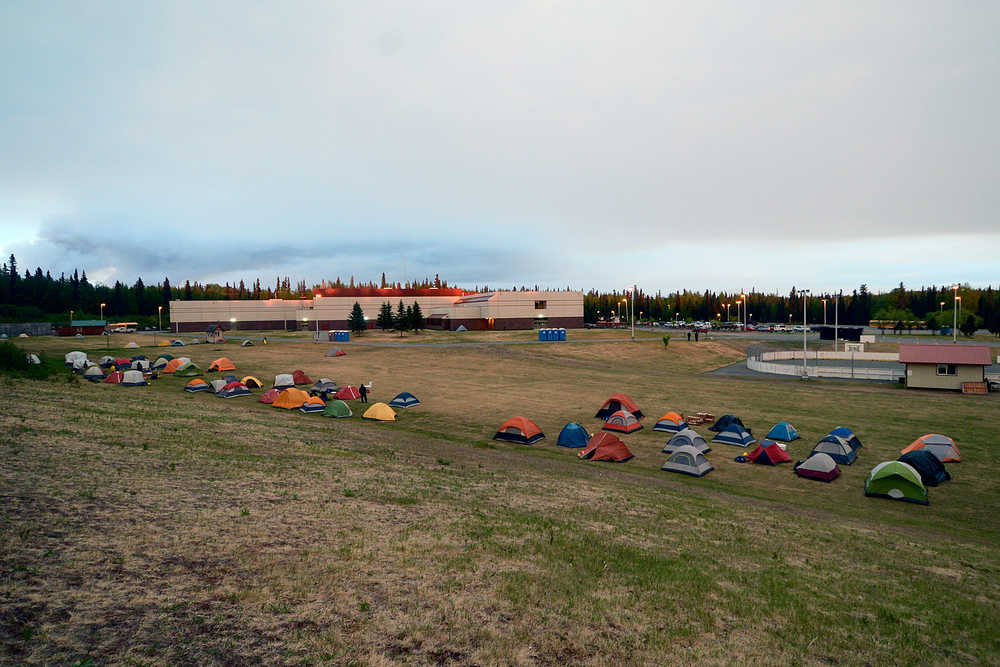Photo by Rashah McChesney/Peninsula Clarion  Fire crews tasked with fighting the Funny River fire set up camp in a field behind Skyview High School Thursday May 22, 2014 in Soldotna, Alaska.