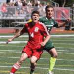 Kenai's Chris Hamilton and Colony's Ben Sande battle for possession during the second half of Colony's 3-2 overtime win over the Kardinals in the Northern Lights Conference Championships semifinals May 23 at Wasilla High School.