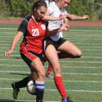 Wasilla's Alexa Starr and Kenai's Heidi Perkins battle for the ball during Kenai's 2-1 win over Wasilla on the second day of the Northern Lights Conference Championships in Wasilla.