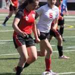 Kenai's Cassie Holmes and Wasilla's Merit Paramo race up the field during Kenai's 2-1 win over Wasilla.