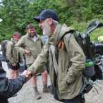 Sean Gobin, founder of Warrior Hike, shakes hands with Jamey Pierson at the Catawba Mountain trail head on May 17, 2014  in Catawba, Va.  Gobin founded the Warrior Hike to coordinate hikes for other veterans who are struggling to adapt to civilian life. This spring, 26 veterans set off on hikes along the AT, the Continental Divide Trail and the Pacific Crest Trail.  (AP Photo/The Roanoke Times, Erica Yoon)  LOCAL TV OUT; SALEM TIMES REGISTER OUT; FINCASTLE HERALD OUT;  CHRISTIANBURG NEWS MESSENGER OUT; RADFORD NEWS JOURNAL OUT; ROANOKE STAR SENTINEL OUT