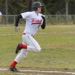 Photo by Rashah McChesney/Peninsula Clarion Kenai's Gabe Boyle heads for first base during their game against Colony Thursday May 29, 2014 during the Northern Lights Conference in Soldotna, Alaska.