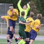Homer goalkeeper Brian Rowe swats a loose ball out of the box during a 1-0 loss to Colony in the ASAA state semifinals May 30 at Anchorage Football Stadium.