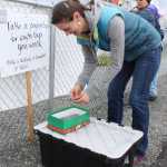 Photo by Kelly Sullivan/ Peninsula Clarion Gine Gregoire takes a paper clip for completing a lap around the KCHS track, Friday, May 30, at the Central Peninsula Relay for Life.
