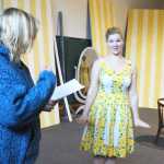 Photo by Kelly Sullivan/Peninsula Clarion Director for the Kenai Performers production of Leading Ladies steps in to read lines with Alyseka Krull during a rehearsal, May 28, in Kalifornsky Beach.
