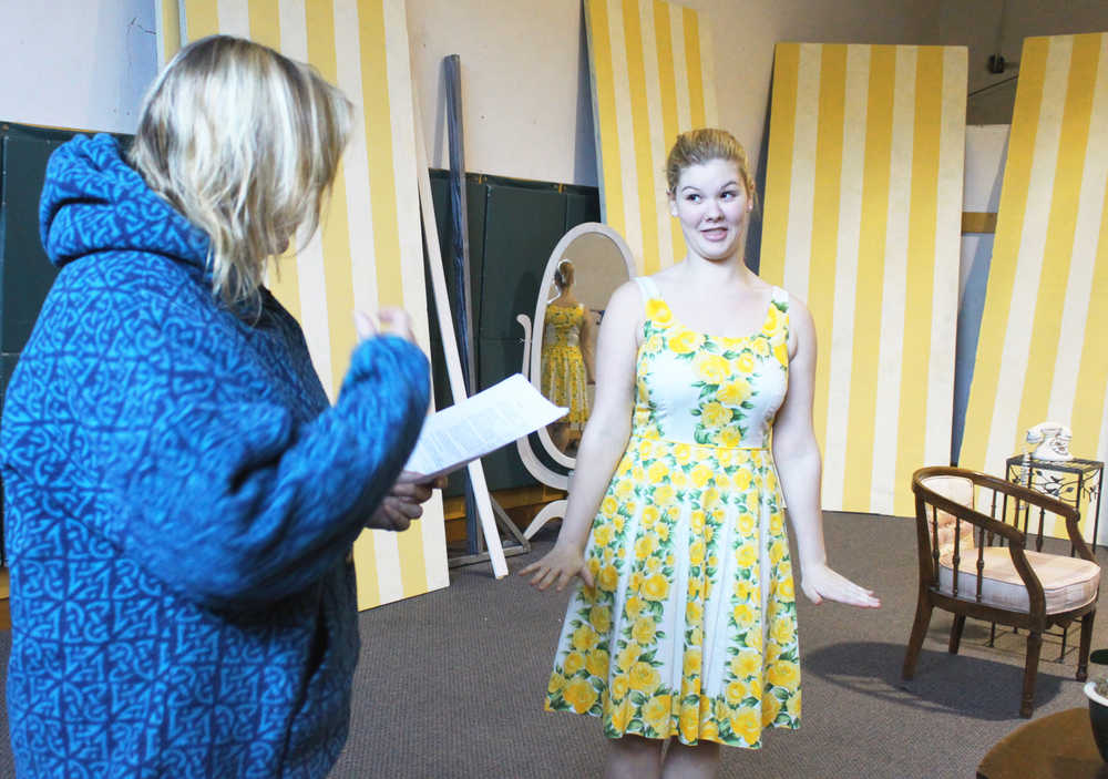 Photo by Kelly Sullivan/Peninsula Clarion Director for the Kenai Performers production of Leading Ladies steps in to read lines with Alyseka Krull during a rehearsal, May 28, in Kalifornsky Beach.