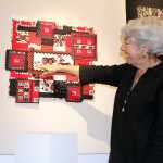 Photo by Dan Balmer/Peninsula Clarion Marilyn Kay Johnson points to her quilt "Bear Squared" on display at the Quilt Art Show at the Kenai Fine Arts Center Wednesday.