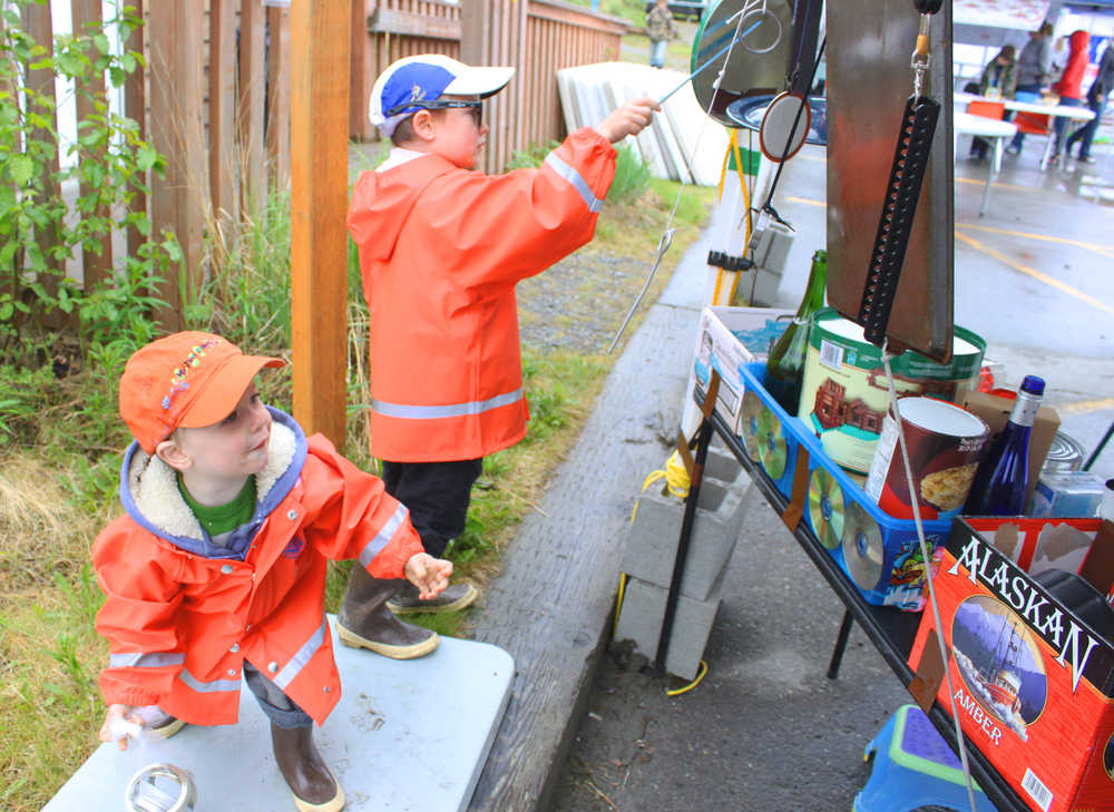 Photo by Kelly Sullivan/Peninsula Clarion Dechen Koos Fox and Marsden Koos Fox play on kitchenware instruments at the 24th annual Kenai River Festival, June 7, at Centennial Park.