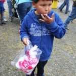 Photo by Kelly Sullivan/Peninsula Clarion Jacob Wohlers enjoys a long awaited cotton candy bag at the 24th annual Kenai River Festival, June 7, at Centennial Park.