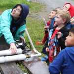 Photo by Kelly Sullivan/Peninsula Clarion Summer Lazenby and other children follow the launch of Caleb Wohlers River Rocket at the 24th annual Kenai River Festival, June 7, at Centennial Park.