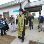 Photo by Rashah McChesney/Peninsula Clarion   Bishop David Mahaffey finishes up the rear of a procession at the end of his blessing on a new outbuilding at the Holy Assumption of the Virgin Mary Russian Orthodox Church Thursday June 12, 2014 in Kenai, Alaska.