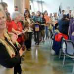 Photo by Rashah McChesney/Peninsula Clarion A cloth-tearing ceremony took place Thursday June 12, 2014 during the grand opening ceremony for the Kenaitze Indian Tribe's Dena'ina Wellness Center in Kenai, Alaska. Everyone who took part tore the cloth into pieces and carried a tangible reminder of the center with them for the rest of the evening.