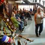 Photo by Rashah McChesney/Peninsula Clarion Yaqui and Otomi Indian Michael Rico smiles at native Yup'ik Rose Gilbeau of Kenai, who stopped when she saw his costume Friday June 13, 2014 during the second day of the grand opening ceremony for the Kenaitze Indian Tribe's Dena'ina Wellness Center in Old Town Kenai, Alaska.