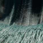 Photo by Rashah McChesney/Peninsula Clarion Several feet of gillnet hung over sawhorses at the Snug Harbor Seafoods receiving dock Thursday June 19, 2014 in Kenai, Alaska. Commercial drifters had their first opening Thursday and will fish regular 12-hour Tuesday and Thursday openings Cook Inlet-wide through early July.