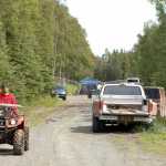 Photo by Rashah McChesney/Peninsula Clarion Volunteers on four-wheelers, horses, on foot and in an airplane combed a section of the woods near an apartment rented by a missing Kenai family Tuesday June 24, 2014 in Kenai, Alaska. The family has been missing since late May.