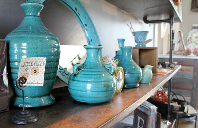 Orange Poppy owner Kenda Blanning offers home décor made by herself and her family as well and local artists' work at her store in Shops Around the Corner in Soldotna. Photo by Kaylee Osowski/Peninsula Clarion