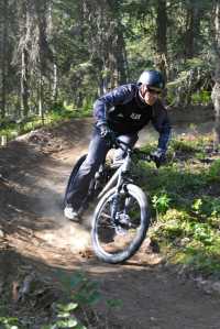 Photo by Rashah McChesney/Peninsula Clarion  Shawn Schooley, one of the designers of the new singletrack mountain bike trail at the Tsalteshi Trails Wednesday July 2, 2014 on the Mosquito Trail in Soldotna, Alaska.